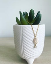 Load image into Gallery viewer, Brushed gold birdcage pendant necklace